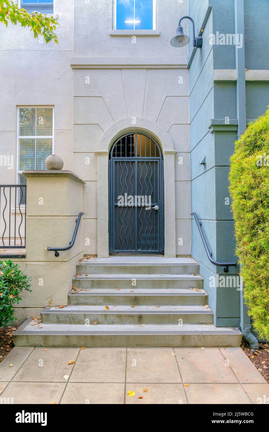 Arched black metal door entrance of a building in Silicon Valley, San