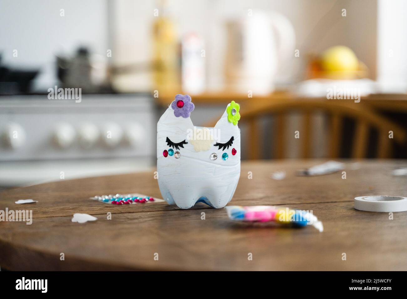 close up of recycled toy of plastic bottle made at home by kid. Sustainable lifestyle