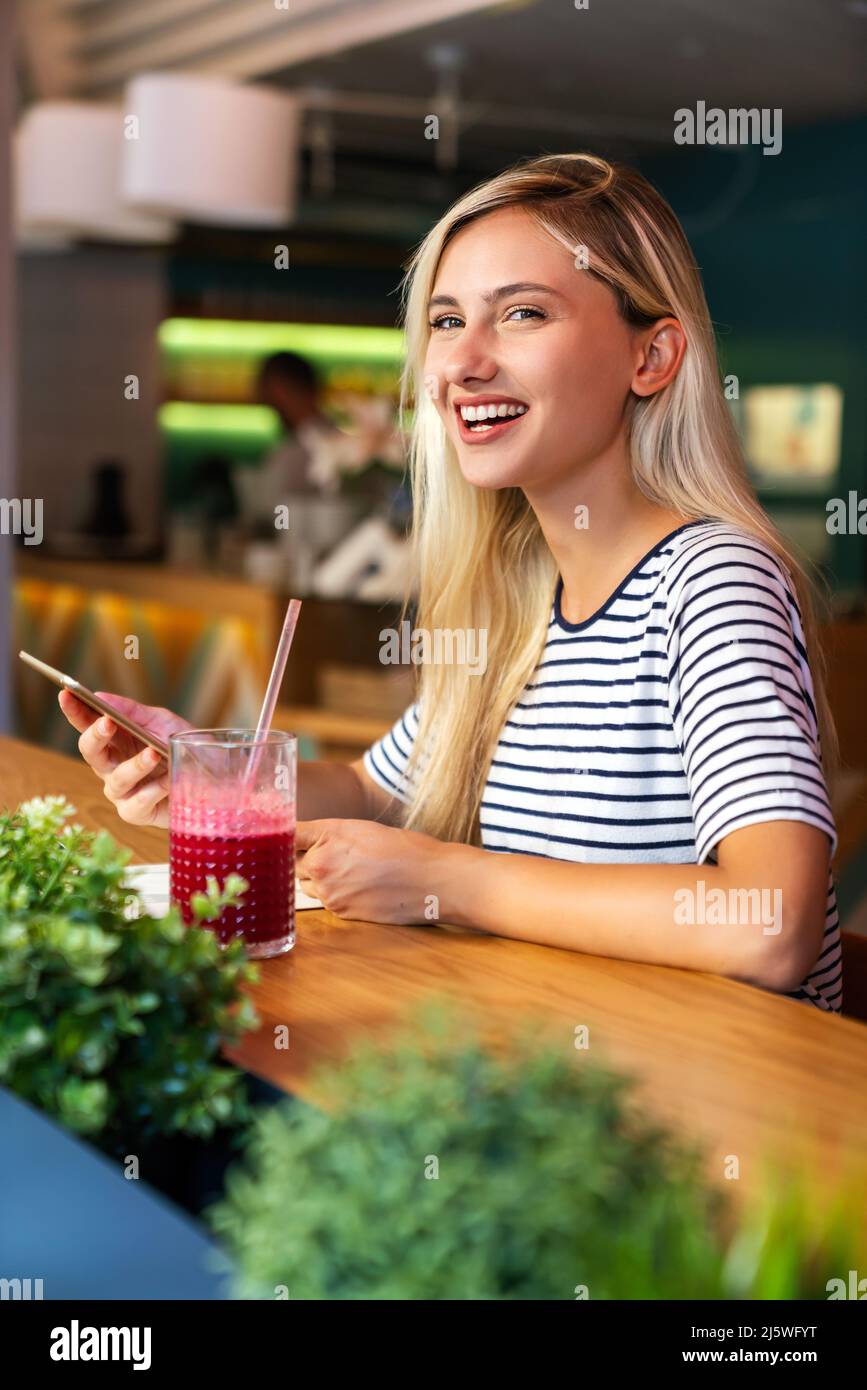 Portrait of young excited woman making a video chat on digital device. People education work concept Stock Photo