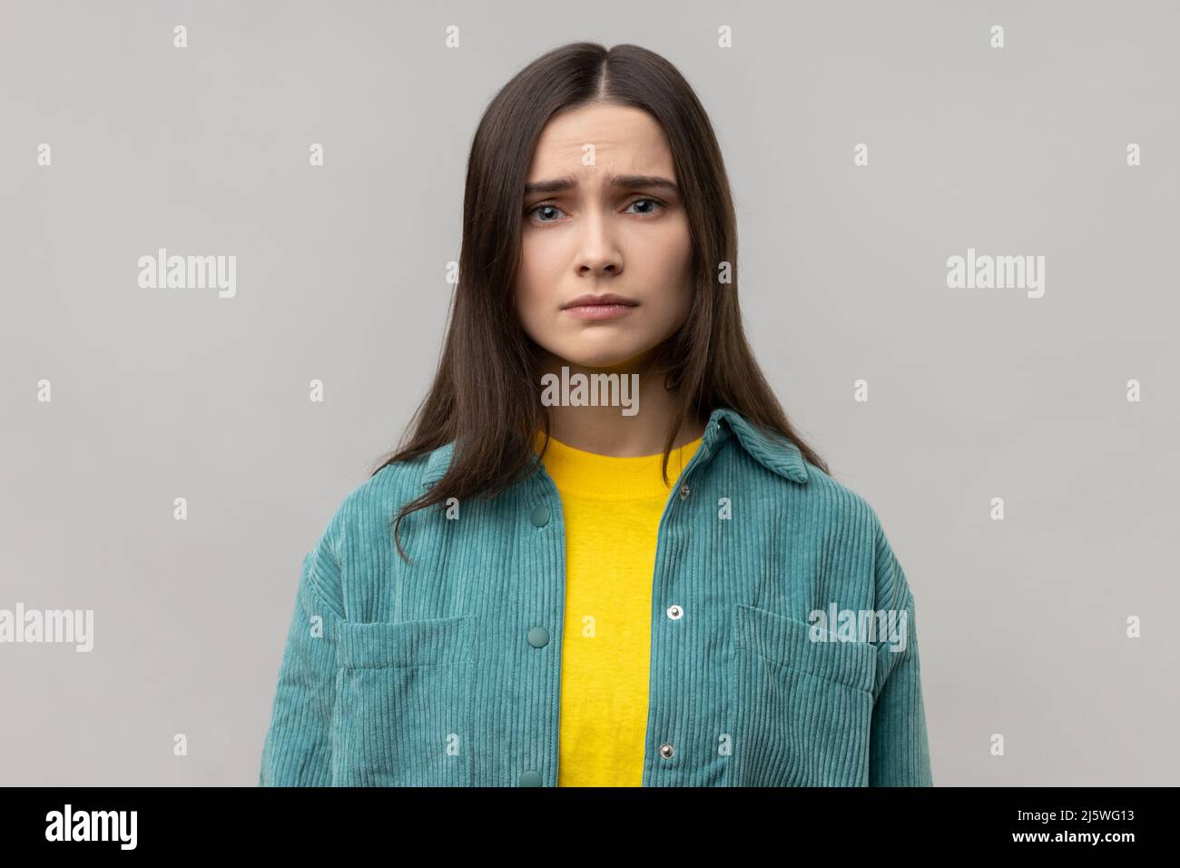 Portrait of disappointed woman being upset of bad news, looking at ...