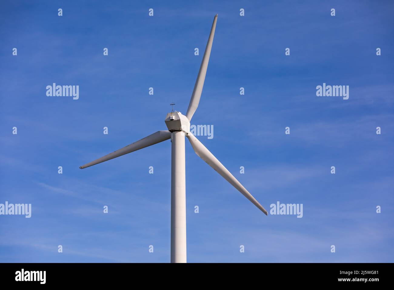 Aerial view of a wind turbine with red and white propellers Stock Photo