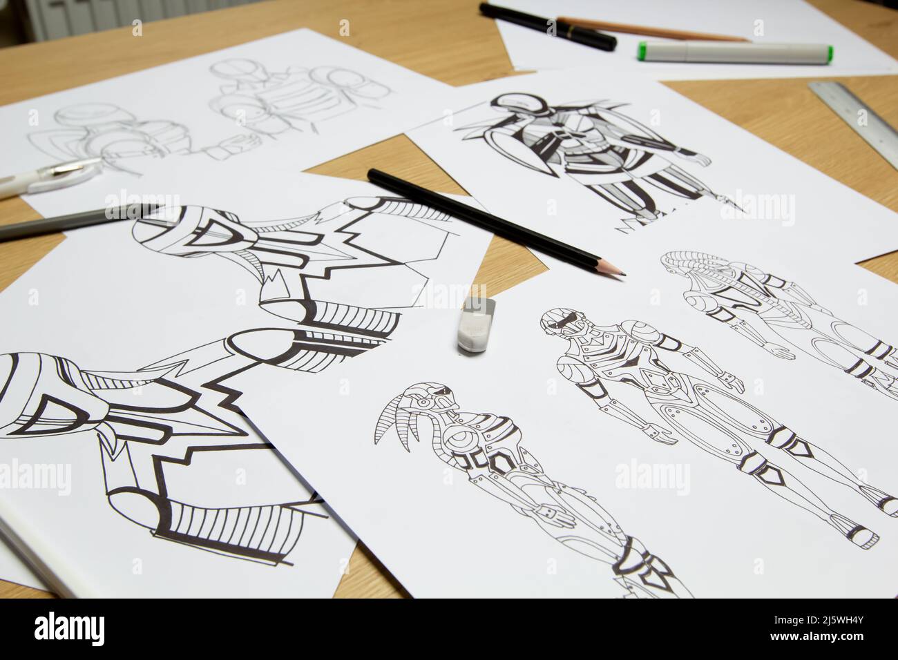 Sketches on paper of animated drawings of cyborg robots as characters for a video game. Concept art. Stock Photo