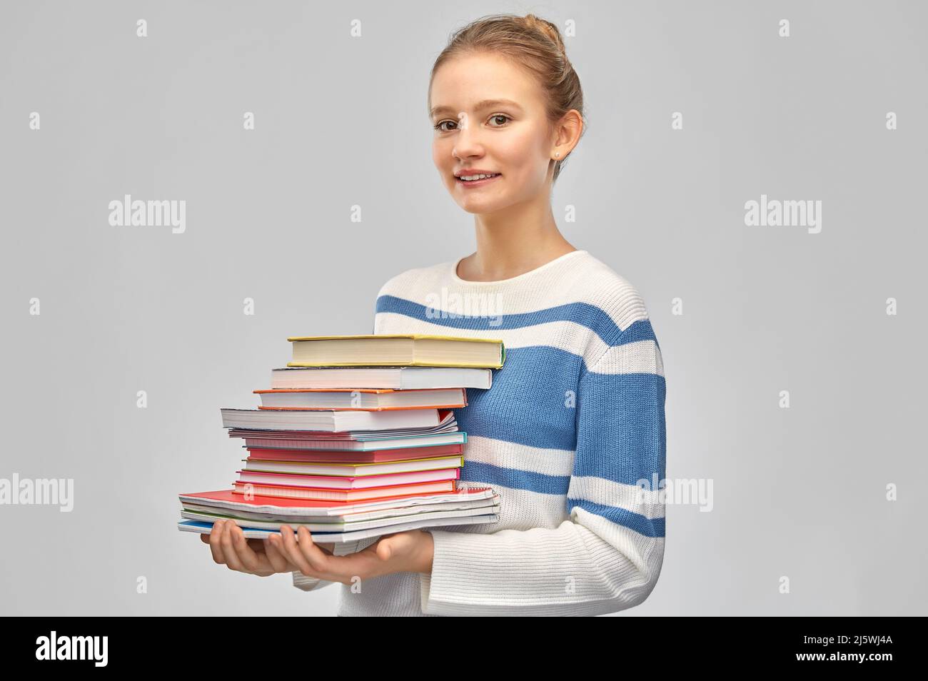 happy smiling teenage student girl with books Stock Photo - Alamy