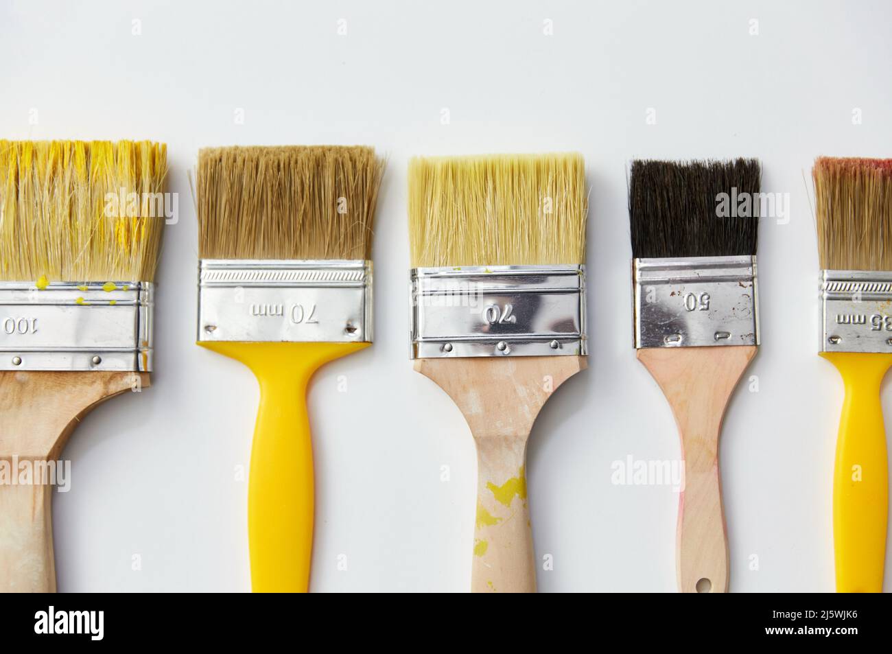 different size paint brushes on white background Stock Photo Alamy