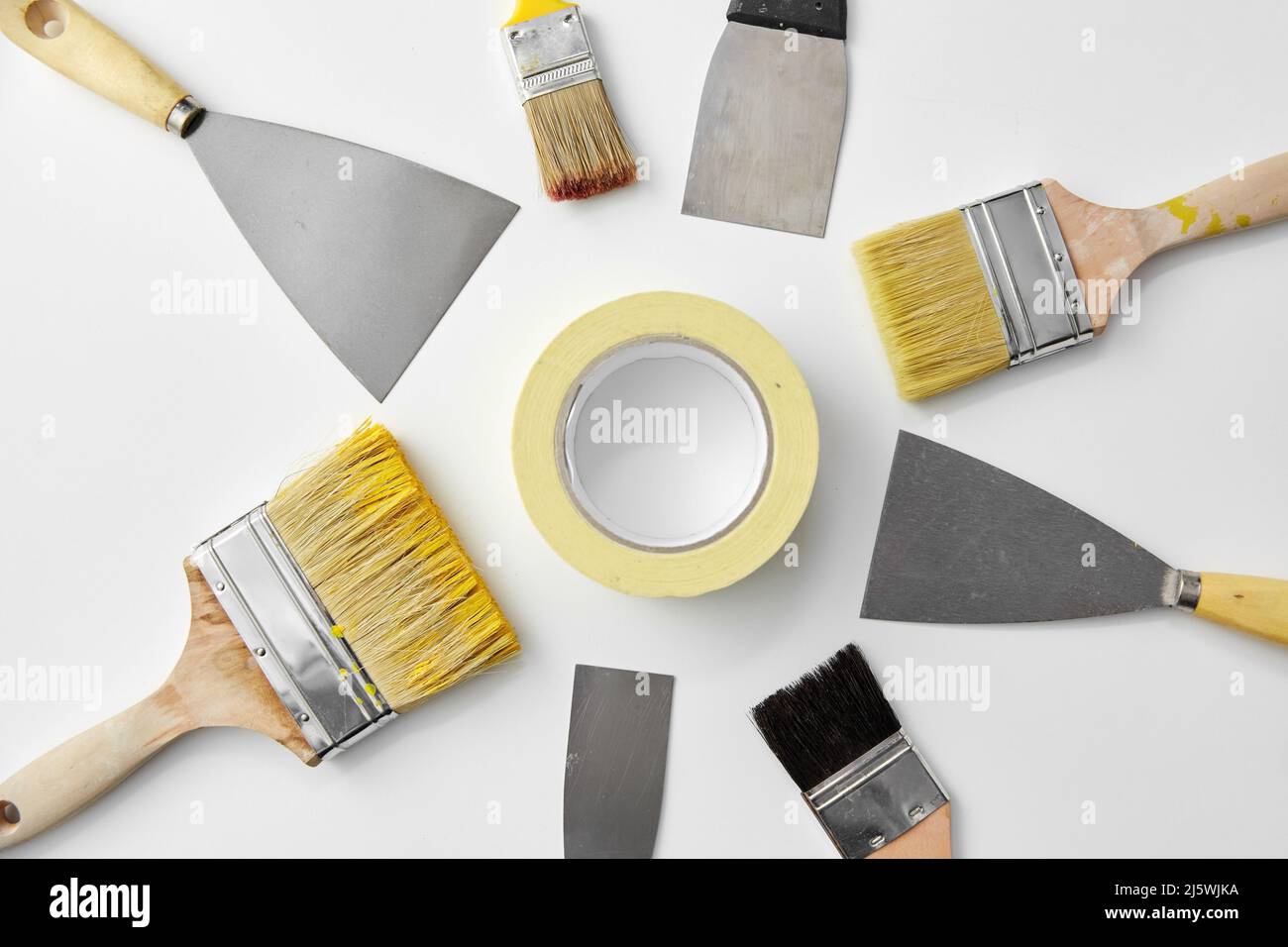 different size paint brushes and putty knives Stock Photo Alamy