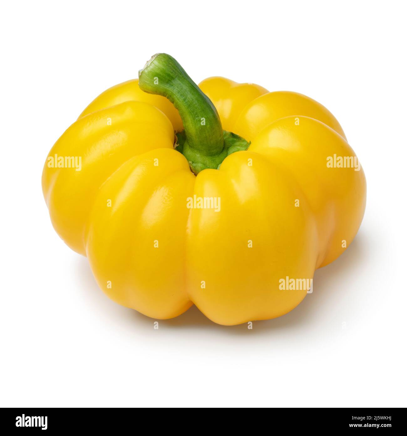 Single fresh picked yellow bell pepper close up isolated on white background Stock Photo