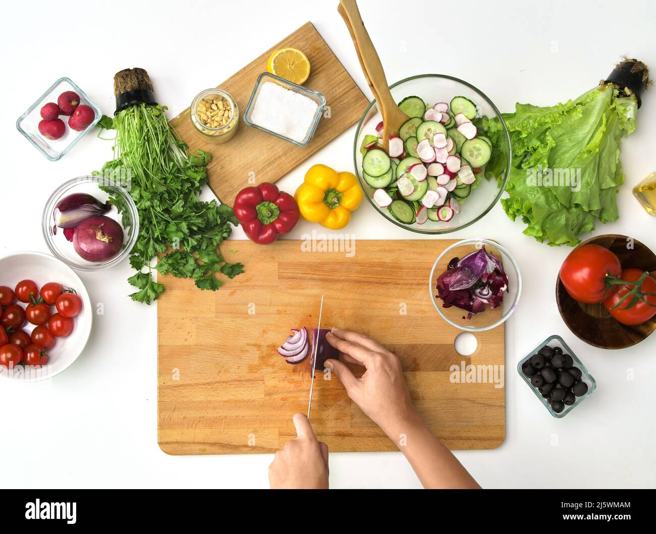 Woman hand cutting red onion hi-res stock photography and images - Alamy