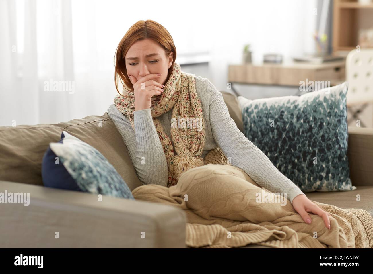 Woman sore throat cough sitting hi-res stock photography and images - Alamy