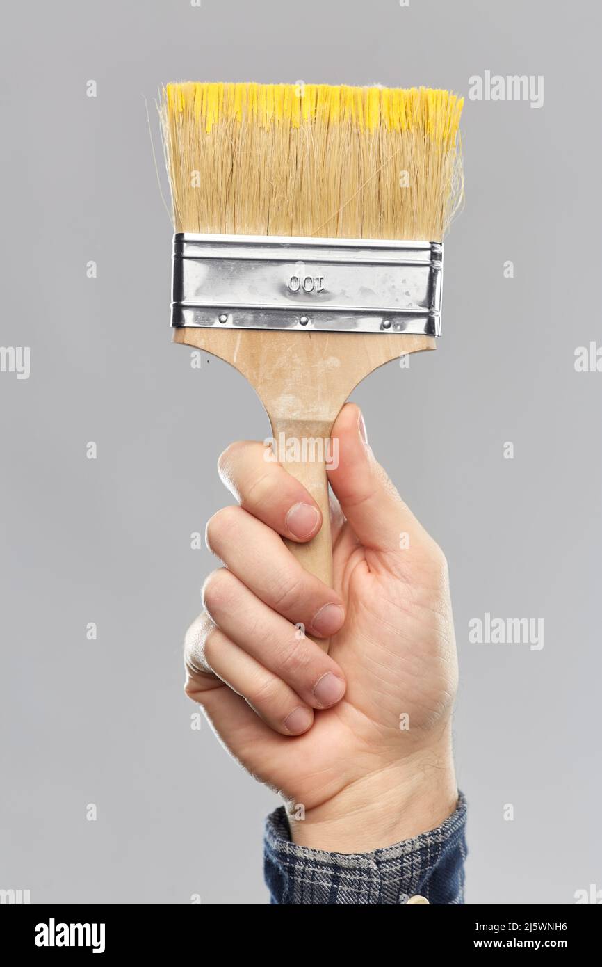 Hand holding paint brush hi-res stock photography and images - Alamy