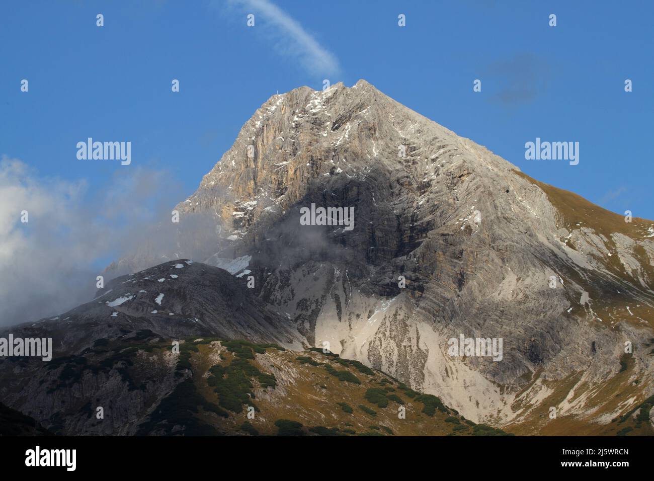Alpine mountain landscape with clouds in Austria Stock Photo