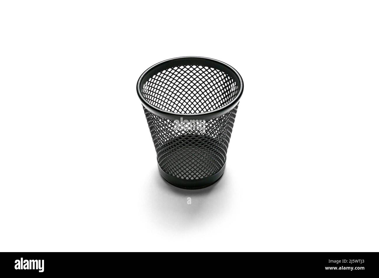 Black plastic basket, isolated on white background with reflection. Stock Photo