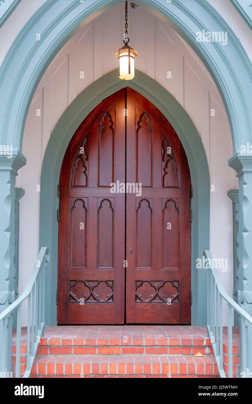 Church entrance with pointed arched wooden double doors at Silicon Valley, San Jose, CA Stock Photo