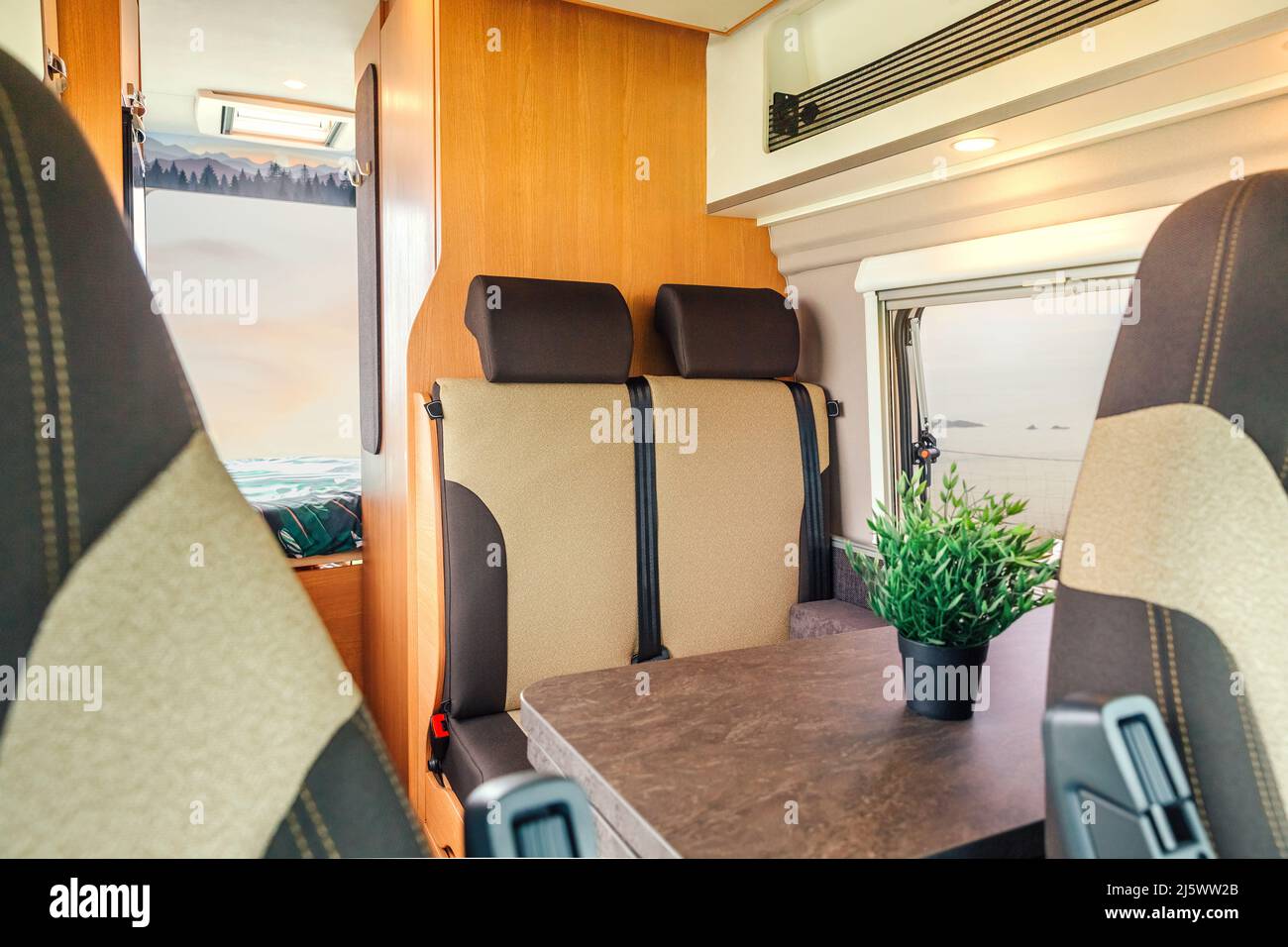 Interior of a camper van with table Stock Photo