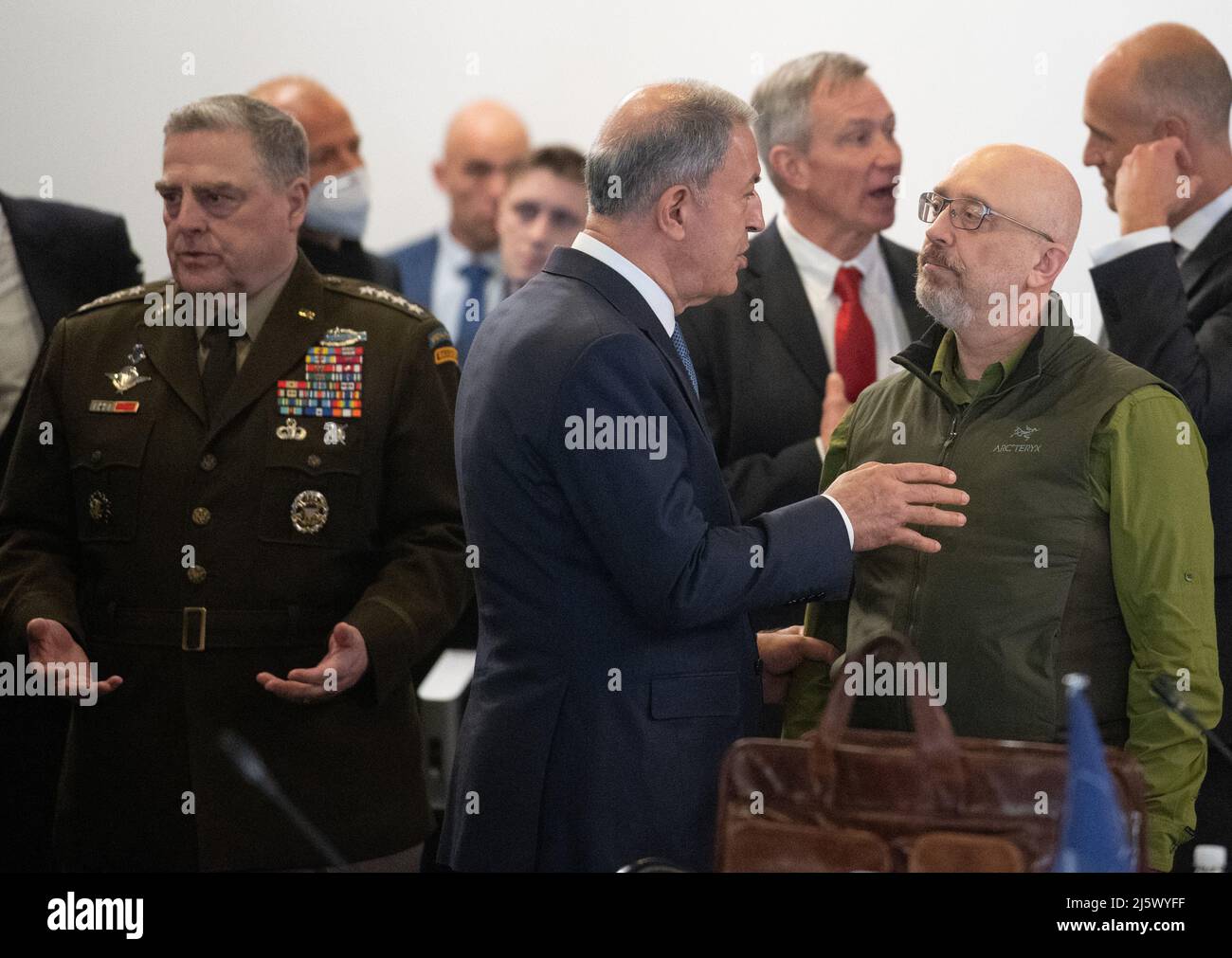 Ramstein, Germany. 26th Apr, 2022. Oleksiy Resnikov (r), defense minister of Ukraine, greets Hulusi Akar (m), defense minister of Turkey, while Mark A. Milley (l), U.S. chief of staff, stands next to him and gestures. Credit: Boris Roessler/dpa/Alamy Live News Stock Photo
