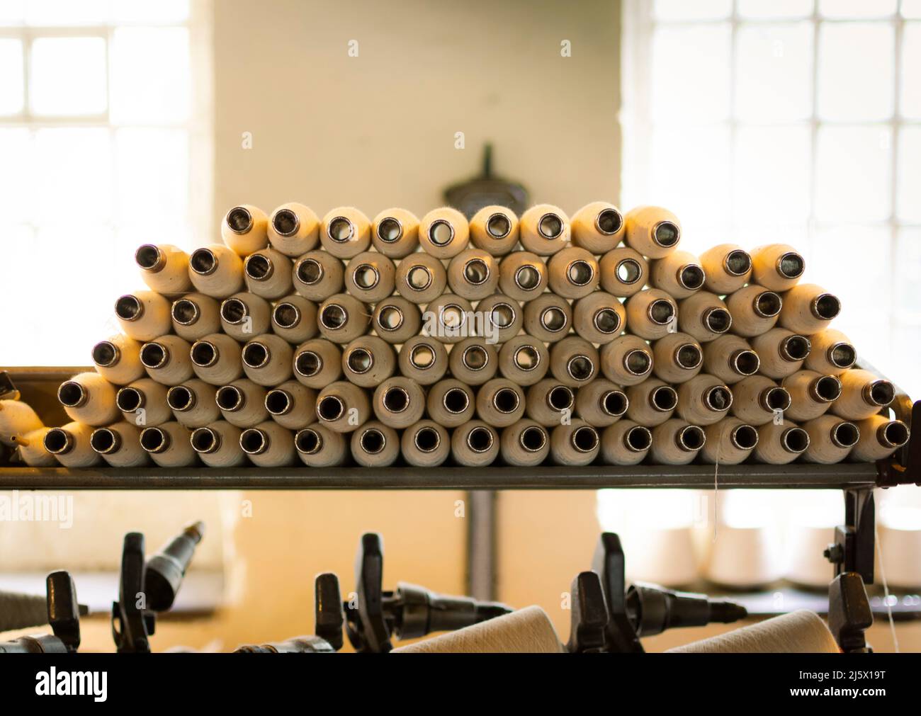 Machines in an old cotton mill. Stock Photo