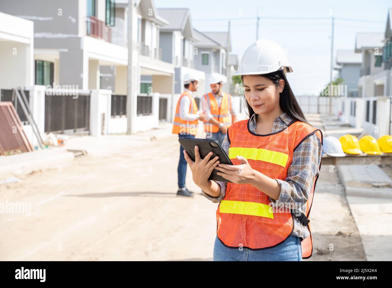 Engineers and architect discussion for plans for new home and working on a building site,Architecture concept. Stock Photo