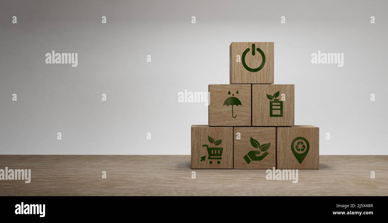 Stacking wooden cube with eco and environment sustainable symbols Circular economy concept. Business and environment sustainable. Climate changing pro Stock Photo