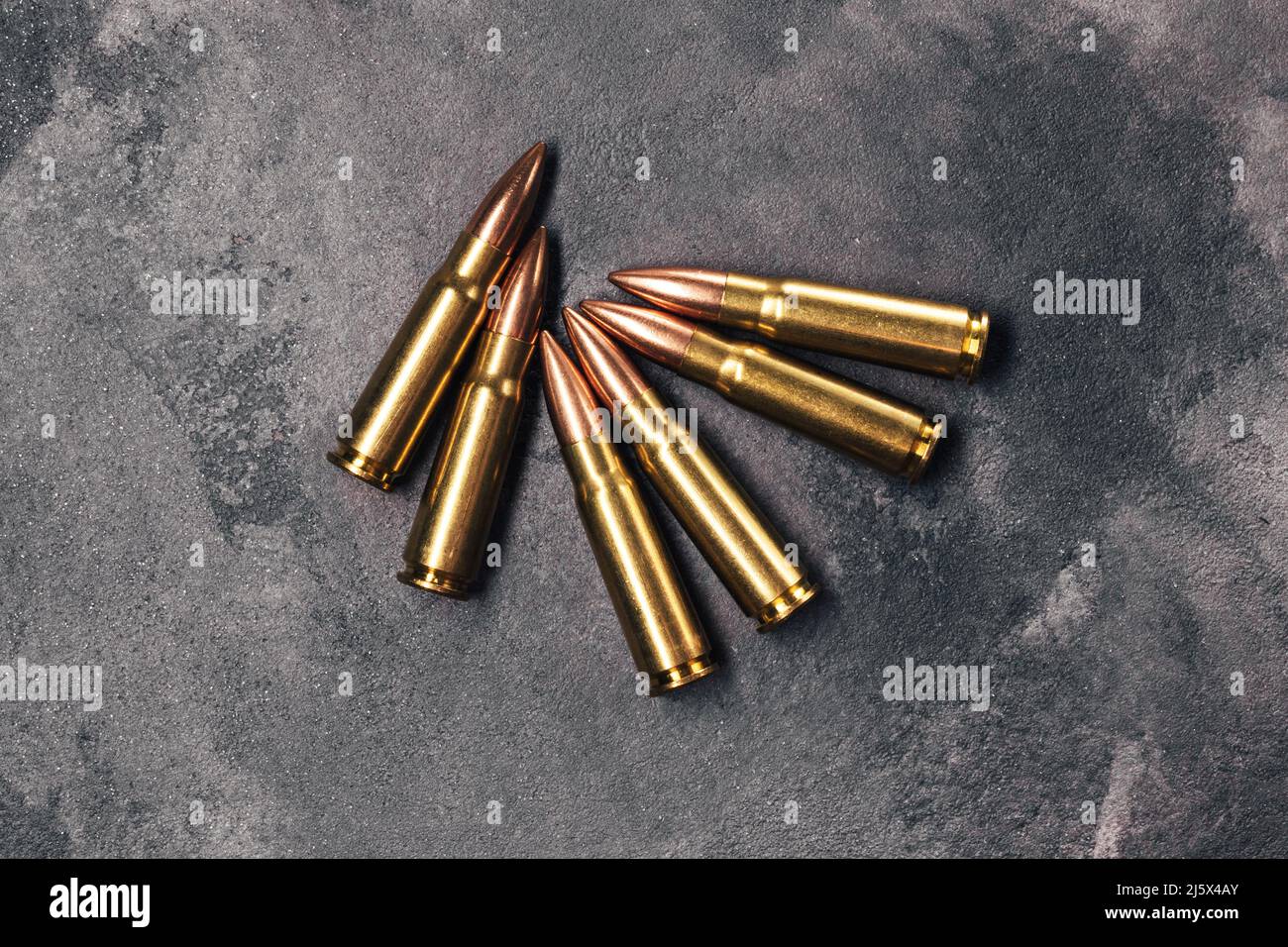 Bullets On Gray Background Cartridges 7 62 Caliber For Kalashnikov Bullets On Gray Background Cartridges 762 Caliber For Kalashnikov Assault Rifle Top View Flat Lay 2J5X4AY