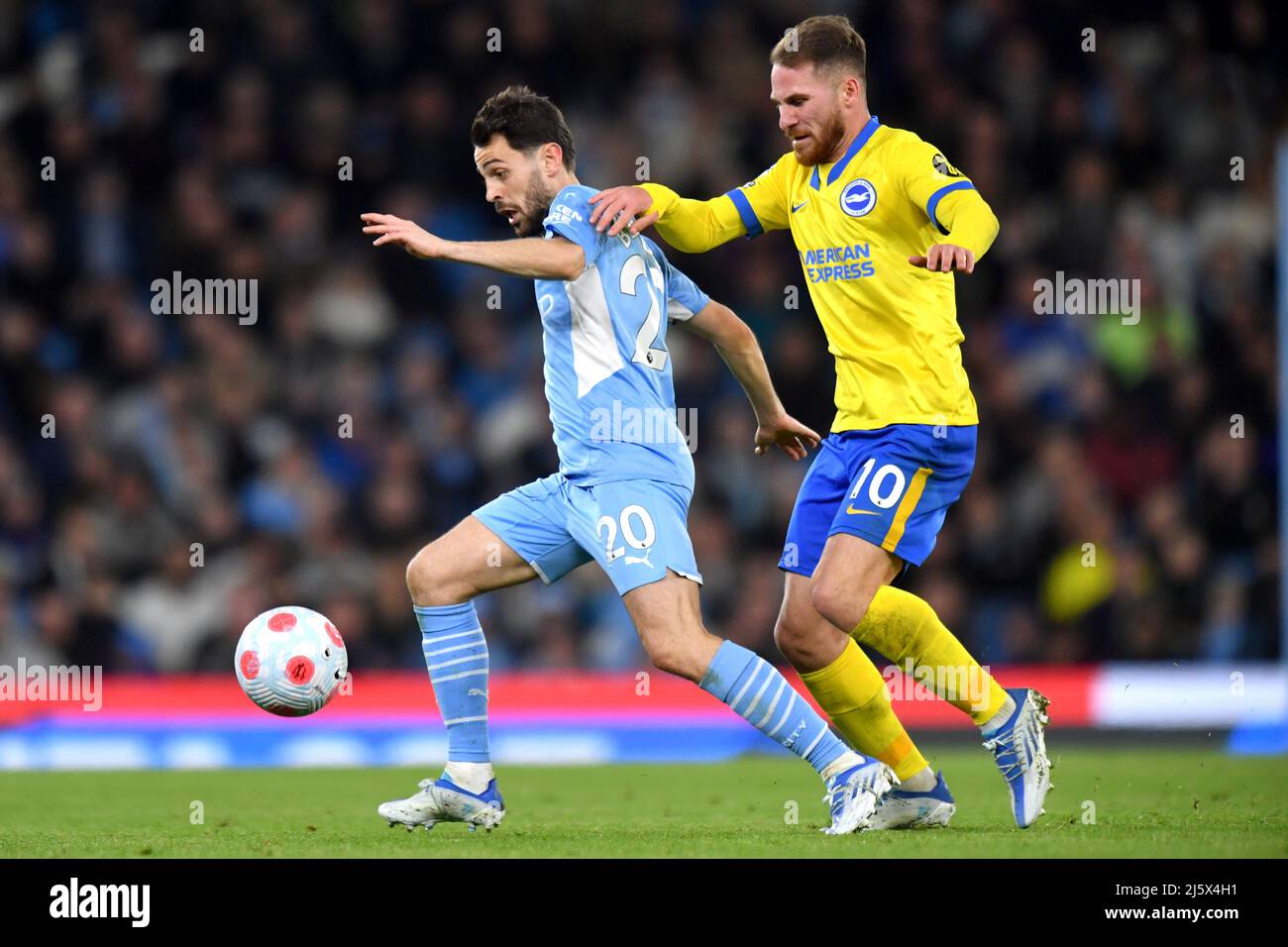 Manchester City's Bernardo Silva and Brighton and Hove Albion's Alex Mac Allister compete for possession. Picture date: Thursday April 21, 2022. Photo credit should read:   Anthony Devlin/Alamy Live News/Alamy Live News Stock Photo