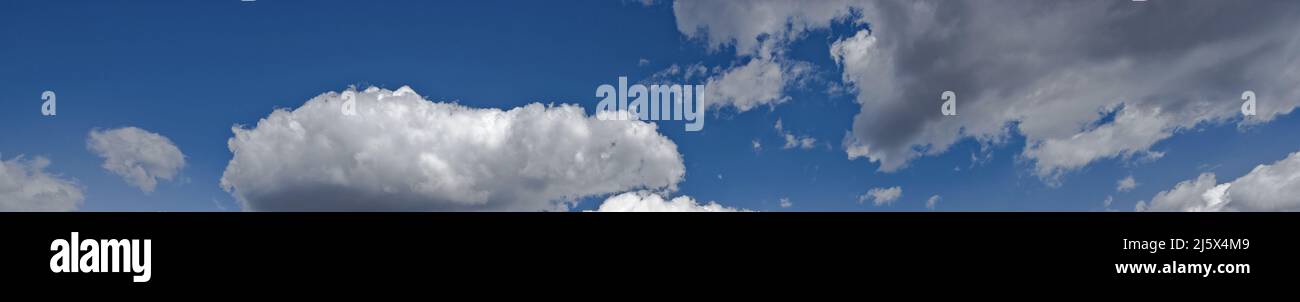 Blue sky with white fluffy clouds used as a background or texture Stock ...
