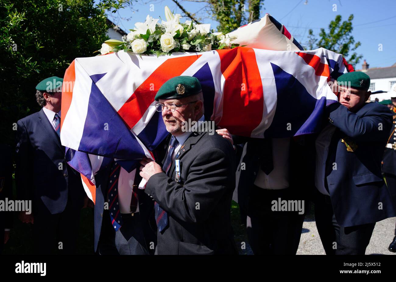 The coffin of 96-year-old World War II serviceman and Royal British Legion fundraiser Harry Billinge is carried into St Paul's Church in Charlestown, Cornwall. Harry was just 18 when he was one of the first British soldiers to land on Gold Beach during the Battle for Normandy and was one of only four survivors from his unit. Picture date: Tuesday April 26, 2022. Stock Photo
