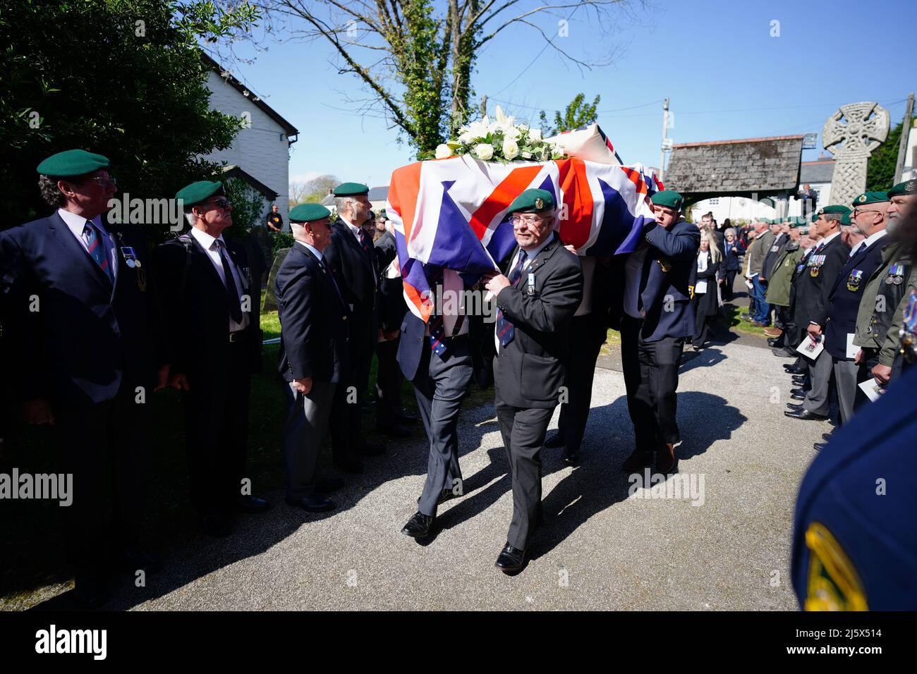 The coffin of 96-year-old World War II serviceman and Royal British Legion fundraiser Harry Billinge is carried into St Paul's Church in Charlestown, Cornwall. Harry was just 18 when he was one of the first British soldiers to land on Gold Beach during the Battle for Normandy and was one of only four survivors from his unit. Picture date: Tuesday April 26, 2022. Stock Photo