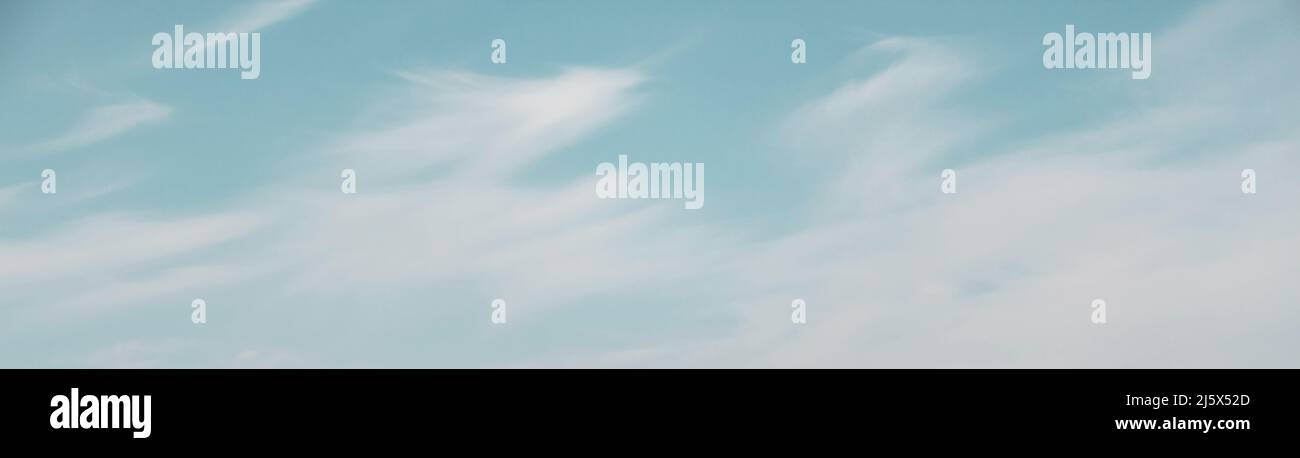 Blue sky with white fluffy clouds used as a background or texture Stock ...
