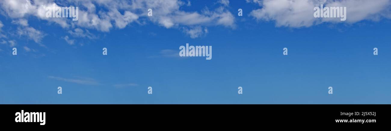 Blue sky with white fluffy clouds used as a background or texture Stock ...