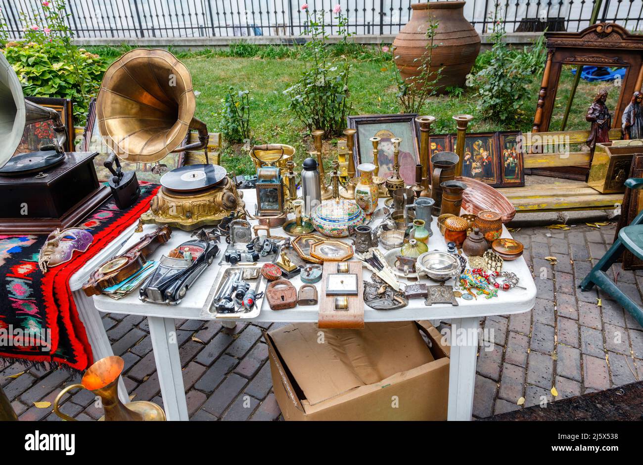 Table with a display of bricabrac for sale at a local roadside flea