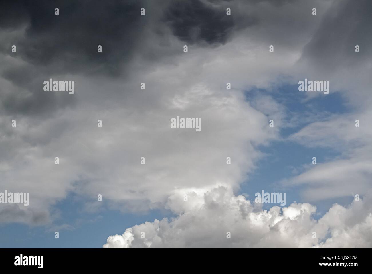 Blue sky with white fluffy clouds used as a background or texture Stock ...