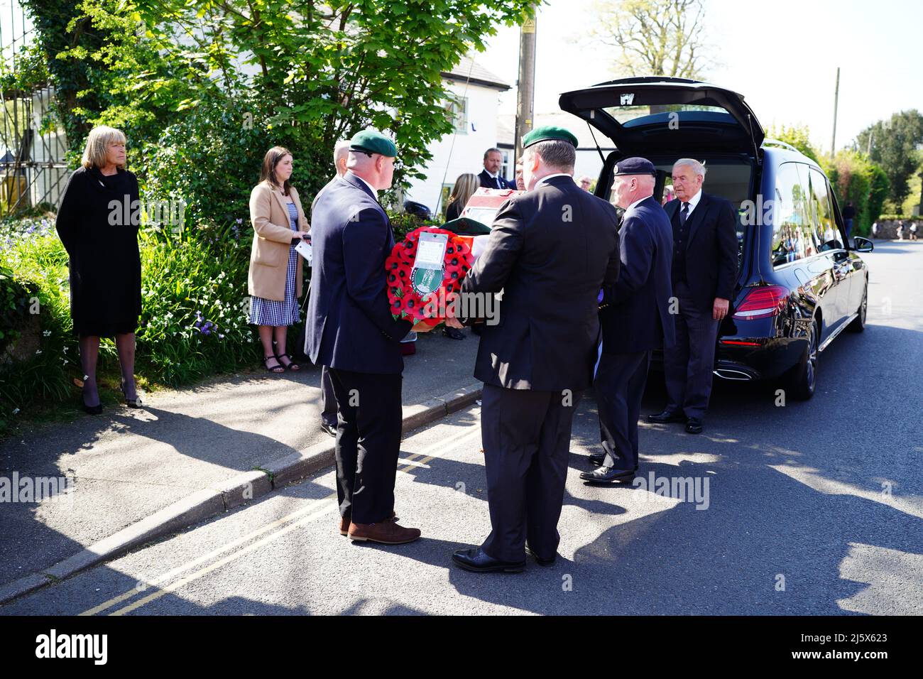 The coffin of 96-year-old World War II serviceman and Royal British Legion fundraiser Harry Billinge, is carried into at St Paul's Church in Charlestown, Cornwall. Harry was just 18 when he was one of the first British soldiers to land on Gold Beach during the Battle for Normandy and was one of only four survivors from his unit. Picture date: Tuesday April 26, 2022. Stock Photo