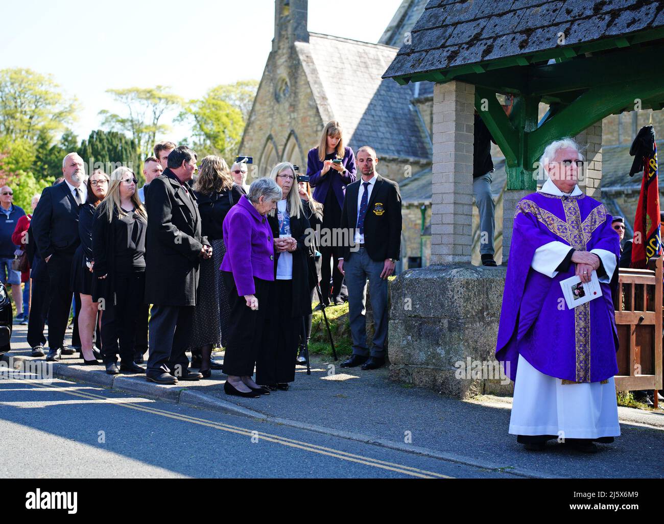 Sheila (front centre) arrives for the funeral service of her husband, 96-year-old World War II serviceman and Royal British Legion fundraiser Harry Billinge, at St Paul's Church in Charlestown, Cornwall. Harry was just 18 when he was one of the first British soldiers to land on Gold Beach during the Battle for Normandy and was one of only four survivors from his unit. Picture date: Tuesday April 26, 2022. Stock Photo