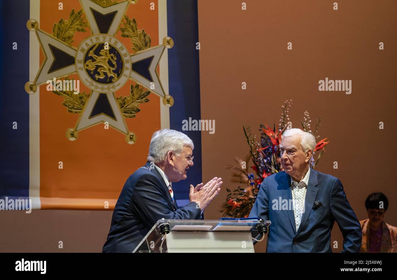 2022-04-26 12:25:41 THE HAGUE - Former journalist and theater producer Henk van der Meijden receives a royal award from mayor Jan van Zanen during the annual ribbon rain. Van der Meijden has been appointed Knight in the Order of Orange-Nassau. ANP BART SIZE netherlands out - belgium out Stock Photo