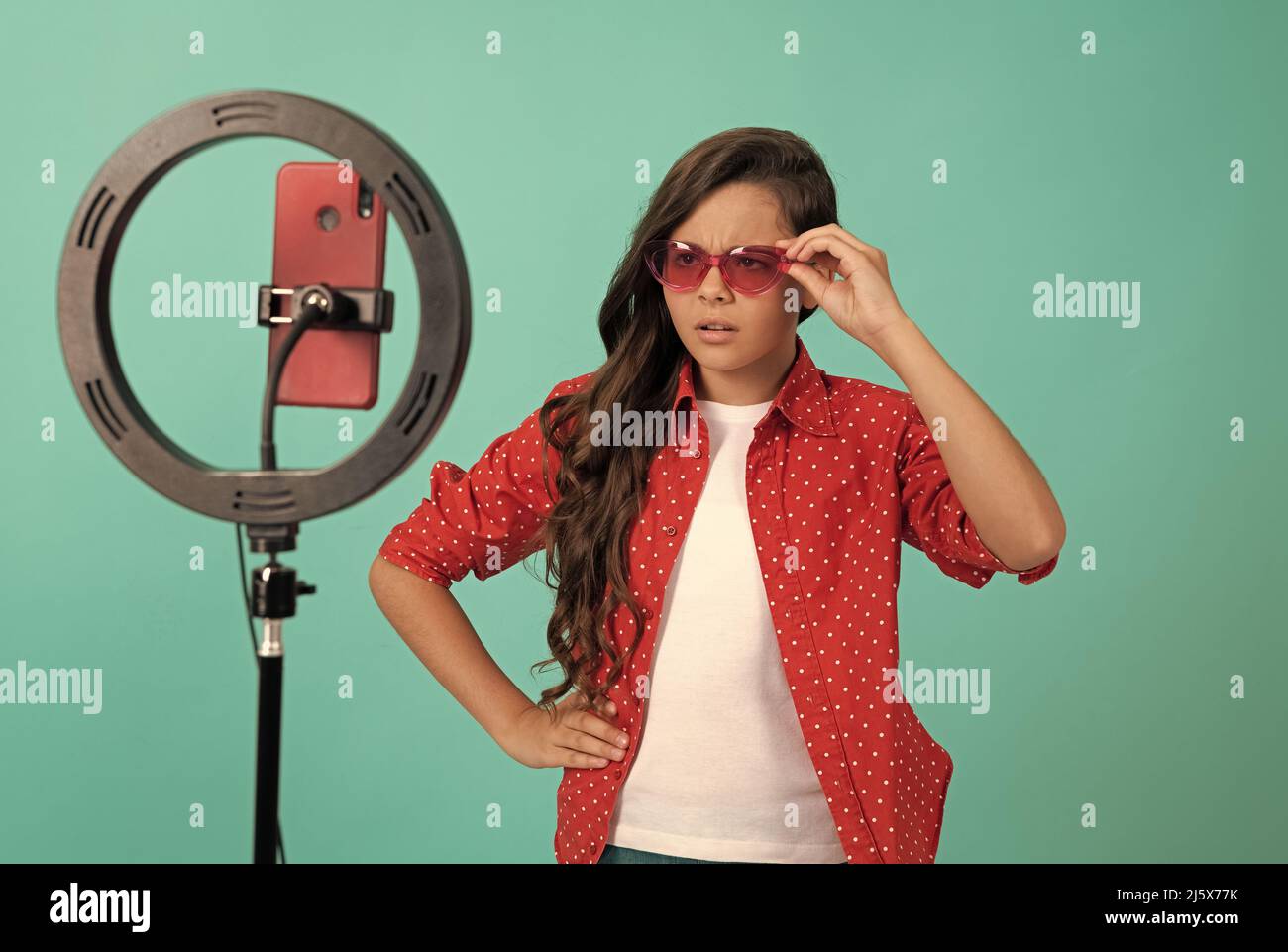 serious teen girl use selfie led. kid beauty blogger. childhood. child in sunglasses. Stock Photo