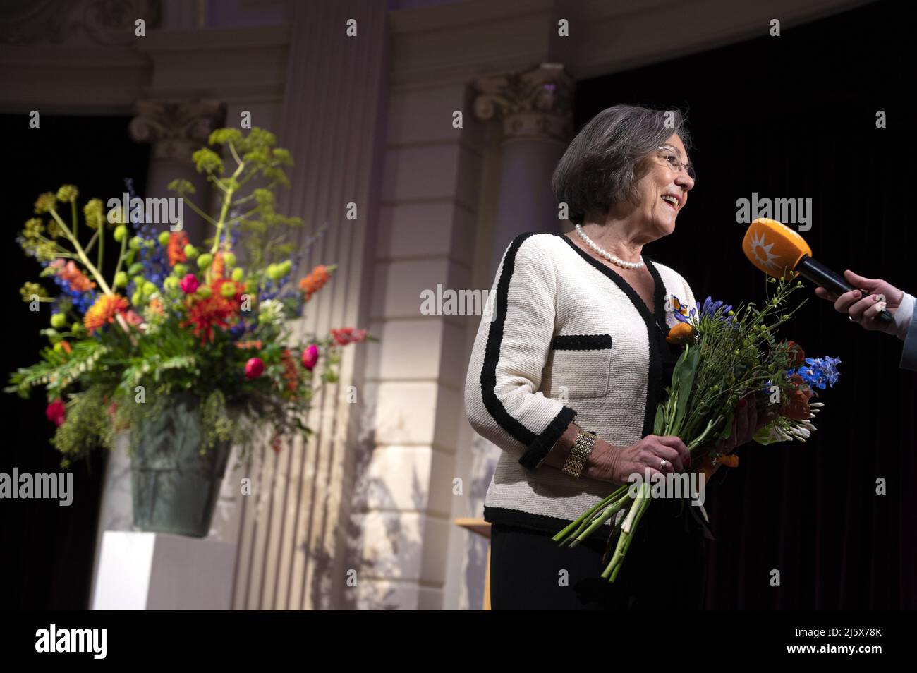 2022-04-26 09:33:23 AMSTERDAM - Dutch politician and administrator Gerdi Verbeet receives a royal award from mayor Femke Halsema during the annual rain of ribbons. Verbeet has been promoted to Officer in the Order of Orange-Nassau. ANP EVERT ELZINGA netherlands out - belgium out Stock Photo