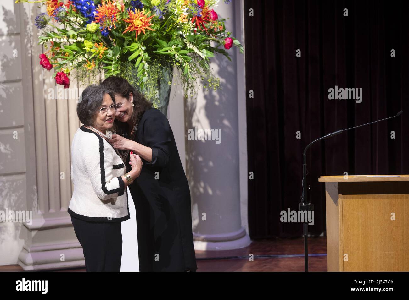 2022-04-26 08:28:36 AMSTERDAM - Dutch politician and administrator Gerdi Verbeet receives a royal award from mayor Femke Halsema during the annual rain of ribbons. Verbeet has been promoted to Officer in the Order of Orange-Nassau. ANP EVERT ELZINGA netherlands out - belgium out Stock Photo