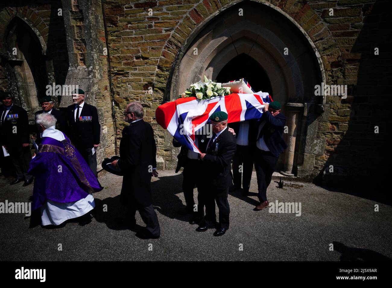 The coffin of 96-year-old World War II serviceman and Royal British Legion fundraiser Harry Billinge is carried out of St Paul's Church in Charlestown, Cornwall. Harry was just 18 when he was one of the first British soldiers to land on Gold Beach during the Battle for Normandy and was one of only four survivors from his unit. Picture date: Tuesday April 26, 2022. Stock Photo
