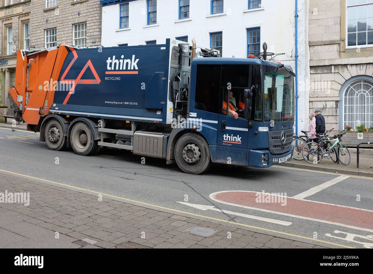 A recycling truck with the branding 'Think' on it waiting at the roadside in Kendal, Cumbria, UK Stock Photo