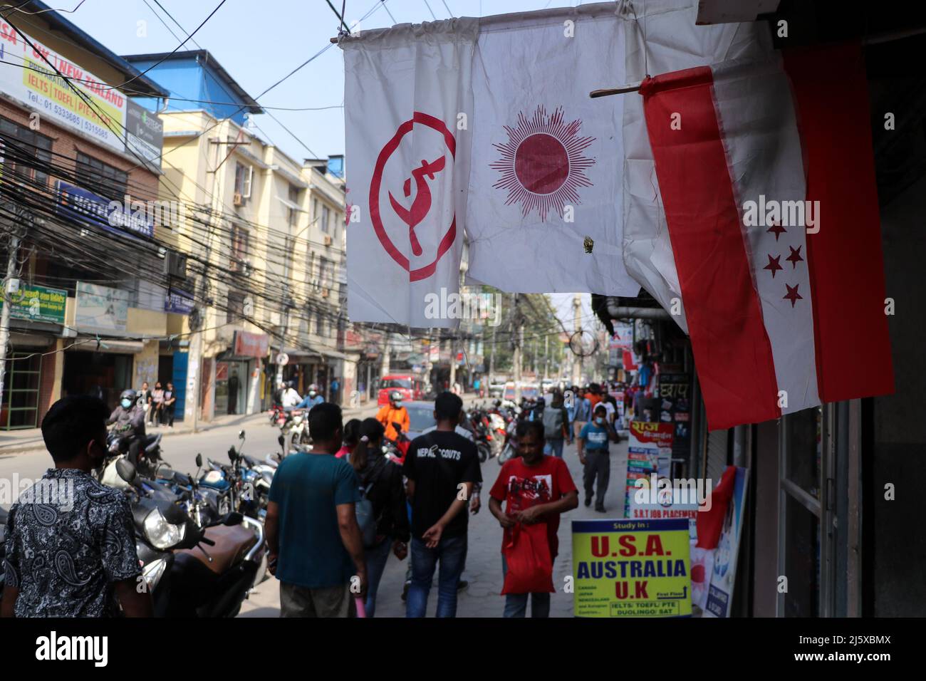 Kathmandu, NE, Nepal. Apr, 2022. Workers flags of various parties in the run-up to the local elections, in Kathmandu, Nepal, on Tuesday, 26, 2022. Nepal is holding the local