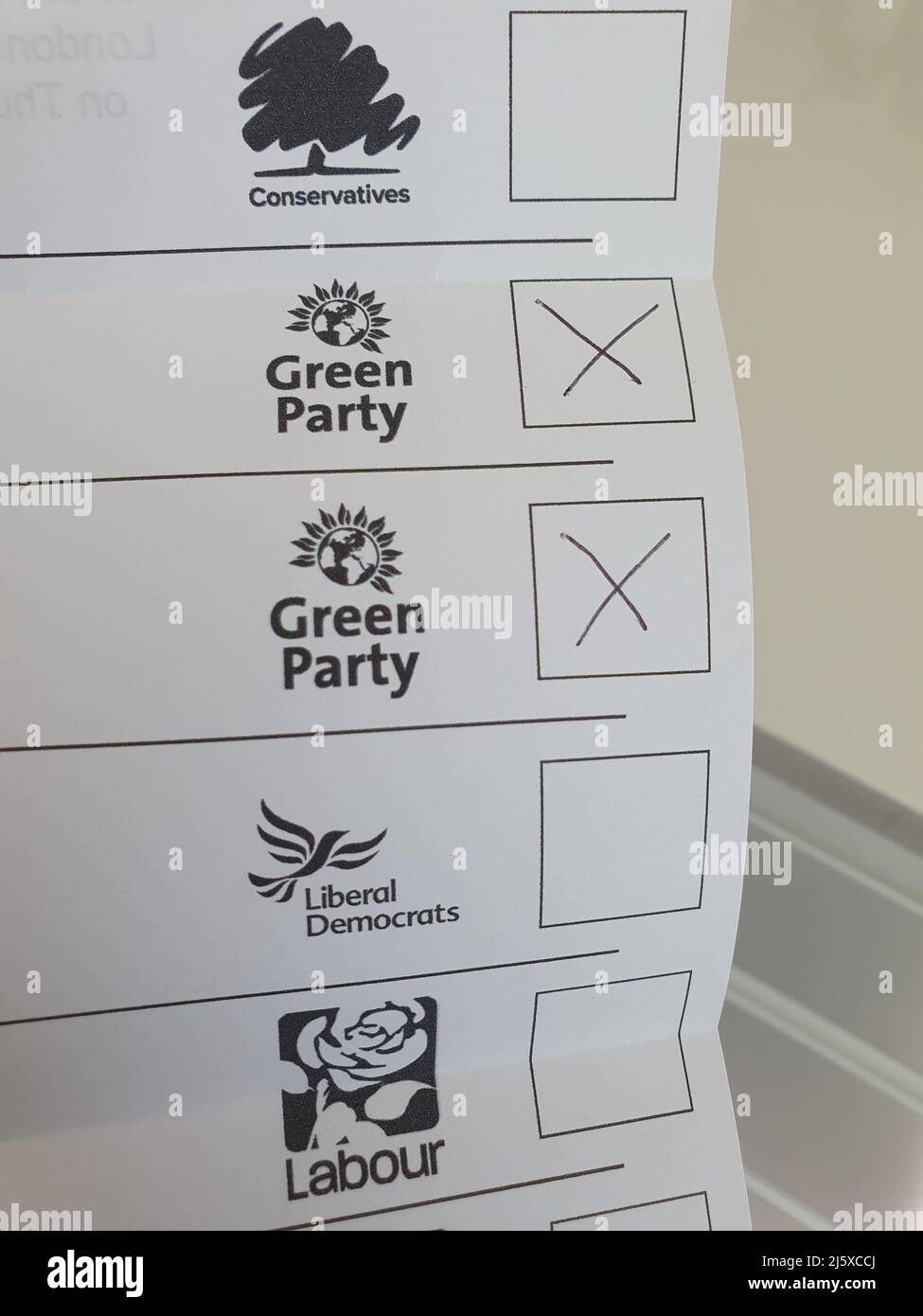 London, UK, 26 April 2022: A local election postal vote paper for the council elections on 5 May is ready to be sent with votes for the Green Party. The Green Party often poll more strongly at local elections than in national elections. Anna Watson/Alamy Live News Stock Photo