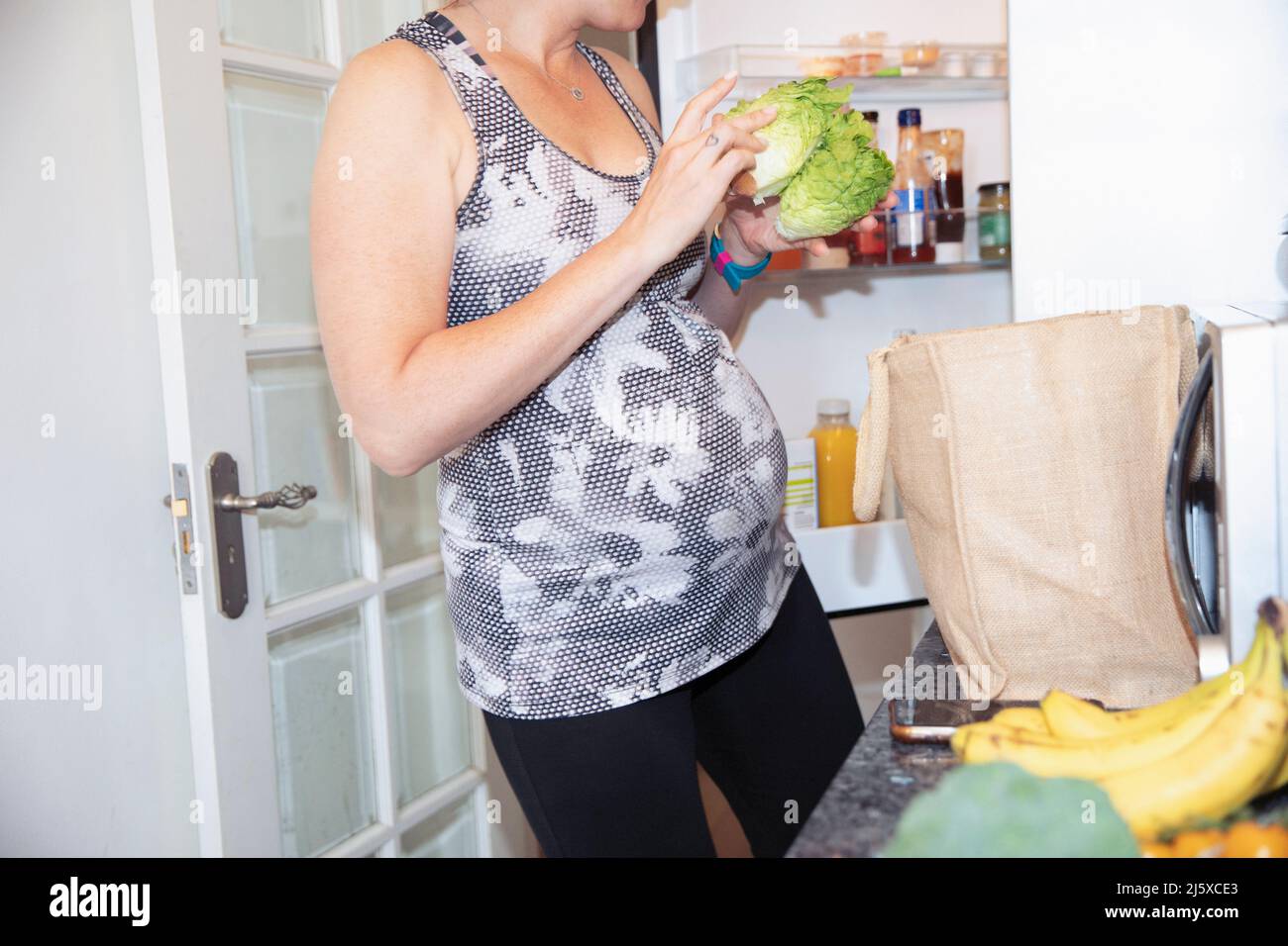 Putting groceries away at home hires stock photography and images Alamy