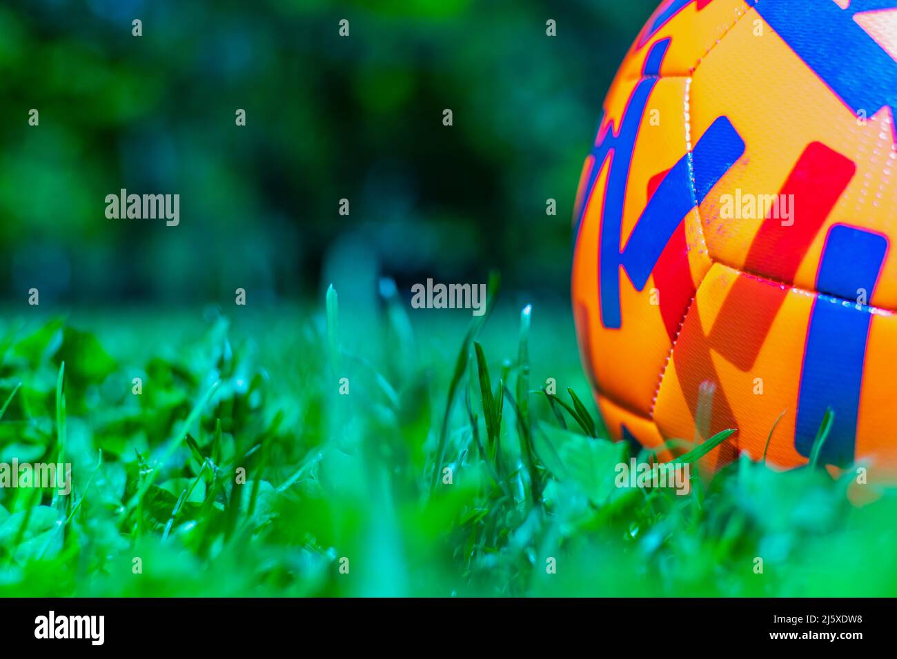 Colorful Football on grass Qatar World Cup 2022 Concept close-up Stock Photo