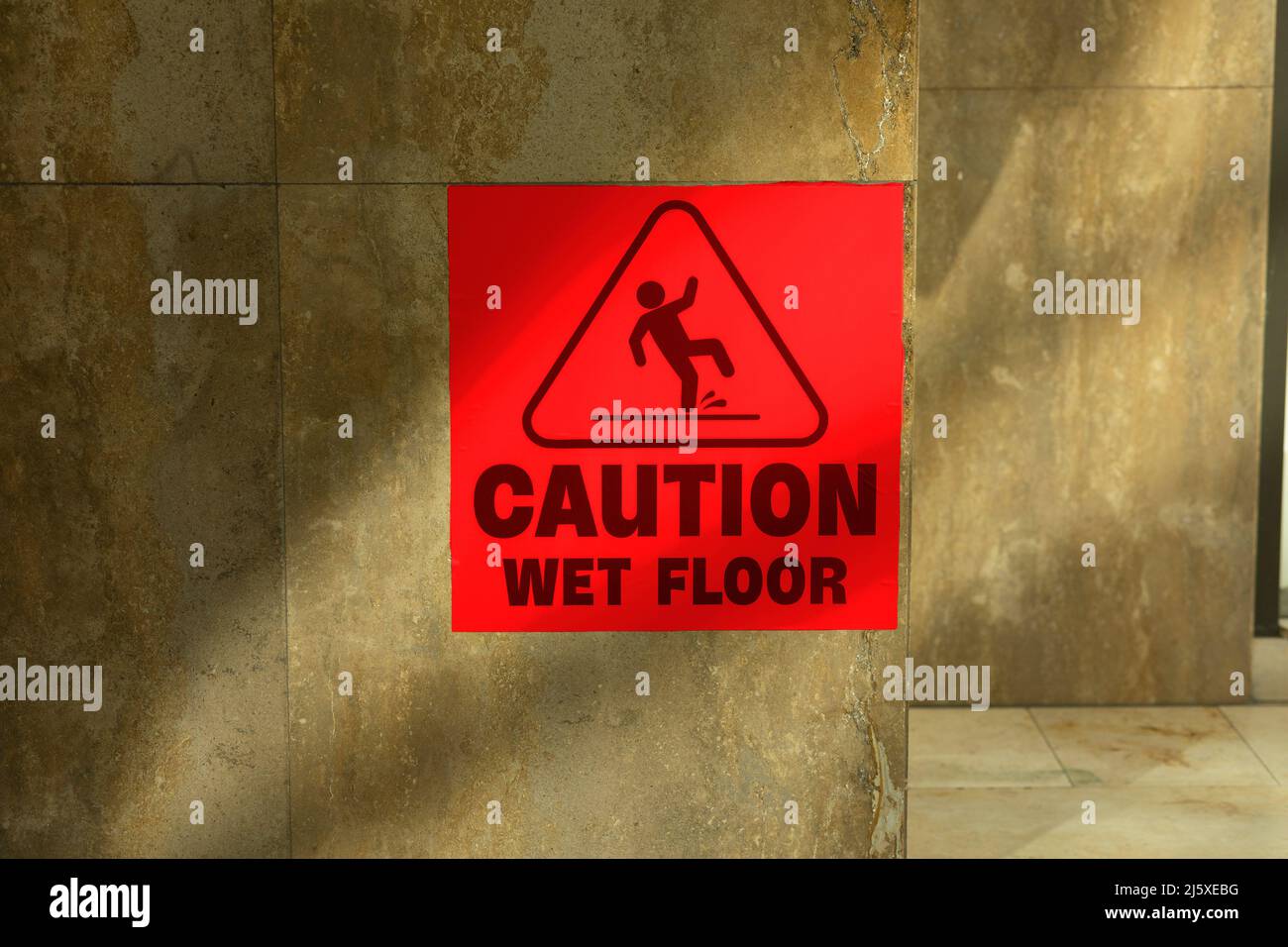 caution wet floor sign in red colour Stock Photo