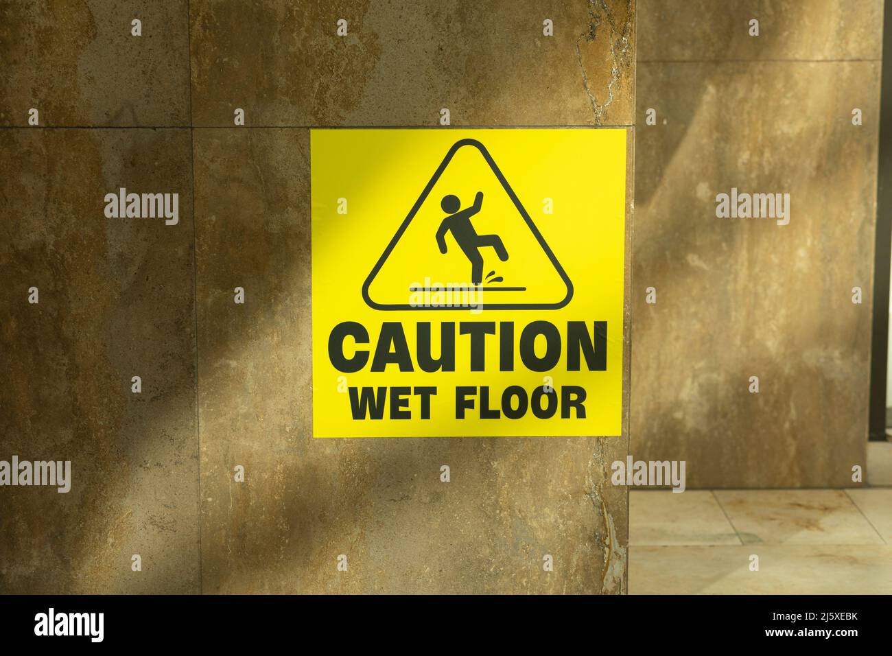 caution wet floor sign in yellow colour Stock Photo
