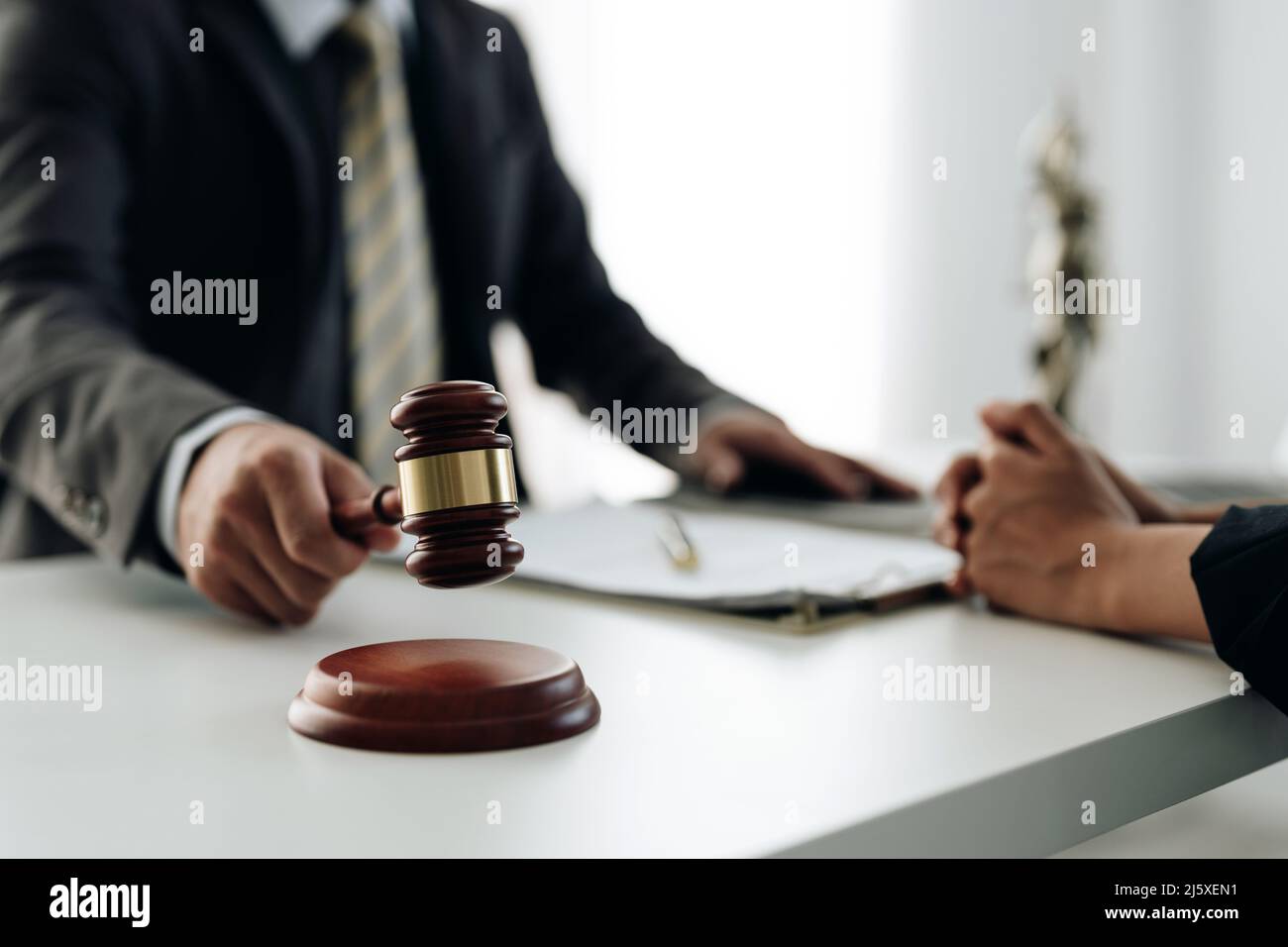 lawyer lawsuit notary consultation or discussing negotiation legal case with document contract women entrepreneurs in the office Stock Photo