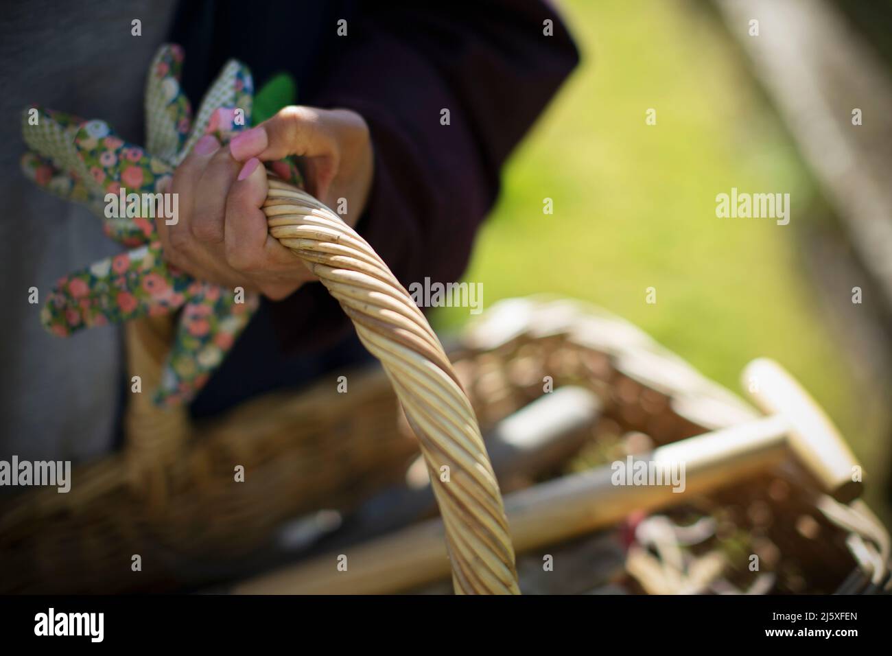 Close up woman holding gardening basket Stock Photo