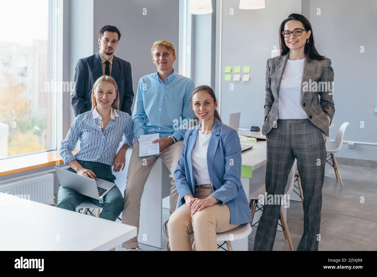 Portrait of successful business team looking at camera Stock Photo - Alamy