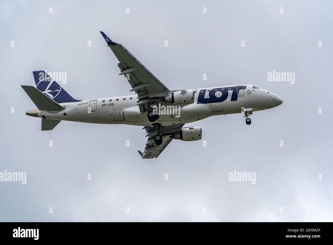 E175 LOT landing at Warsaw Chopin Airport Stock Photo