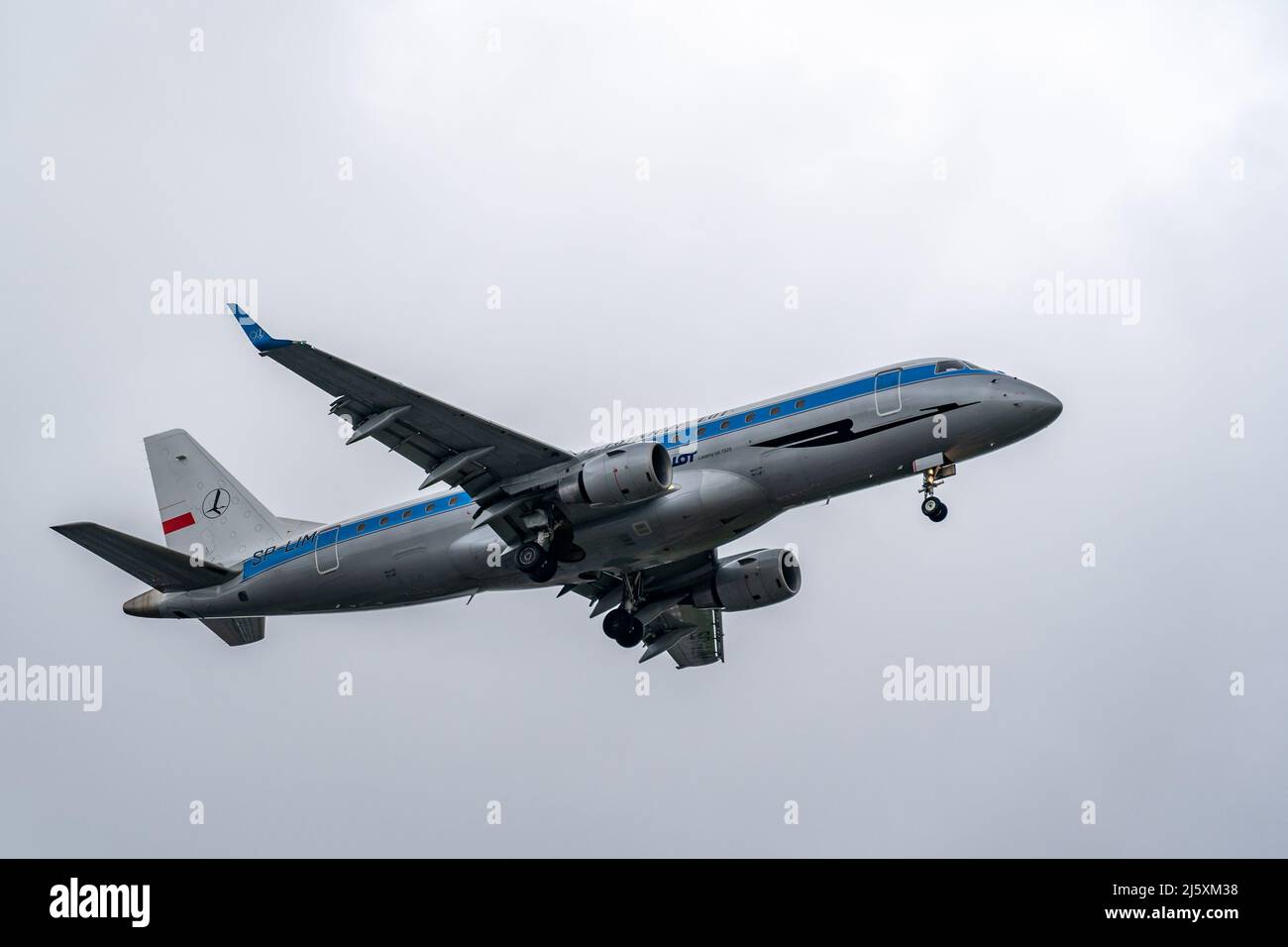 E175 landing at Warsaw Chopin Airport Stock Photo
