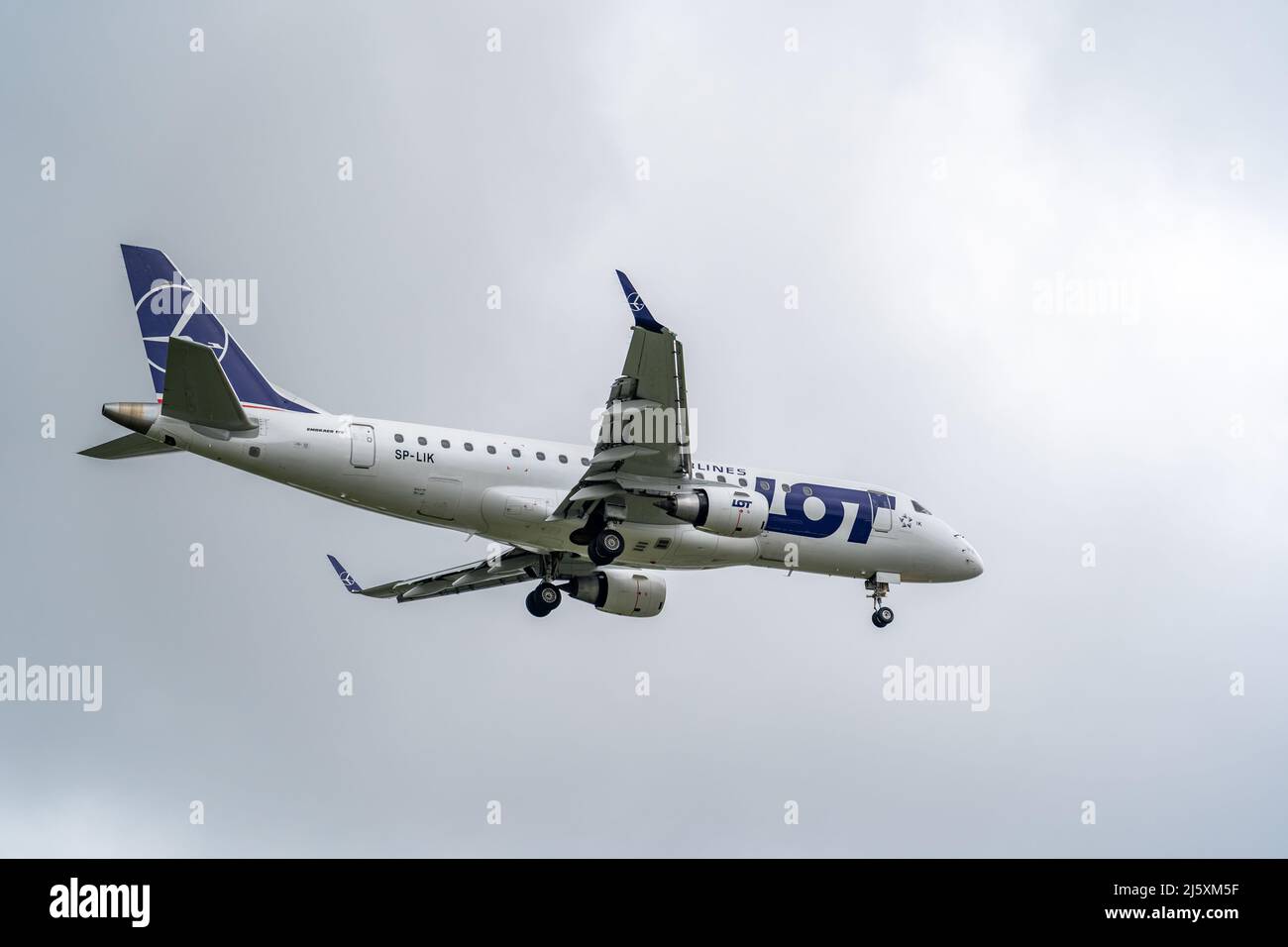 E175 LOT landing at Warsaw Chopin Airport Stock Photo